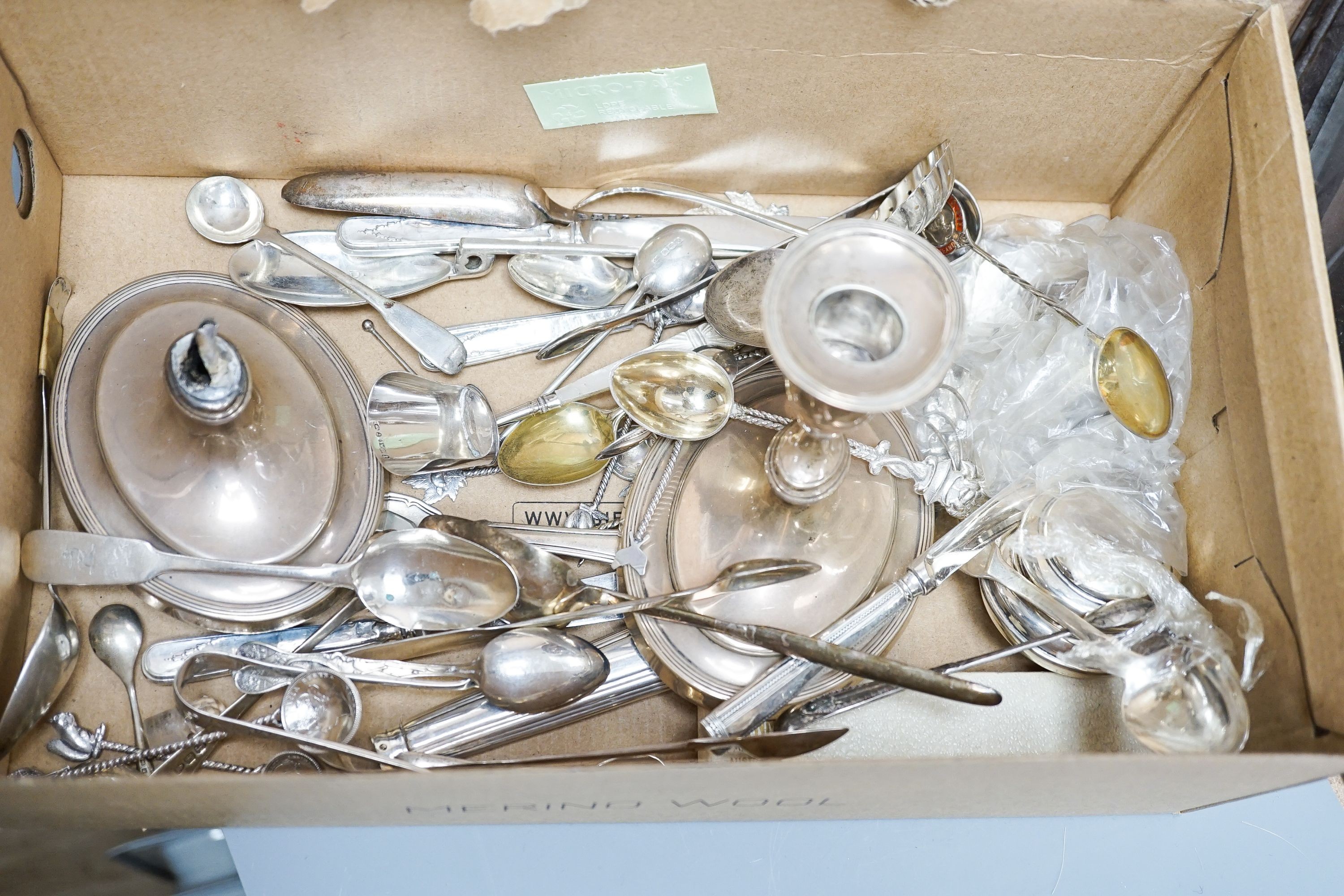 A mixed collection of sundry English and other silver to include a cigarette case, wishbone sugar nips, scent bottle, mixed cutlery, napkin rings, trinket box, etc. (some a.f.) and some plated items.